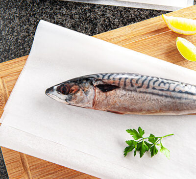 Example of Bartec packaging greaseproof paper for wrapping fish. Customised bespoke wrapping for fish processors